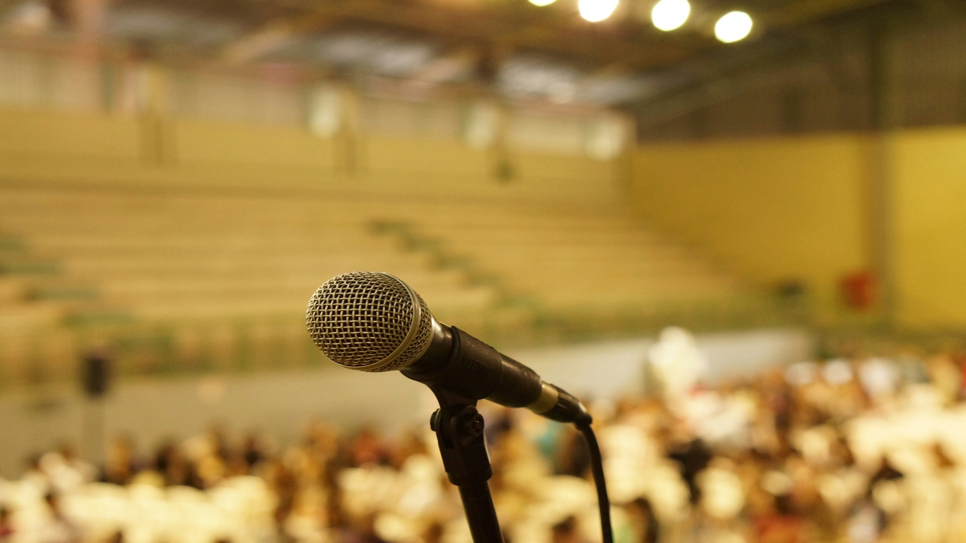 How to speak in public confidently. Microphone on stage